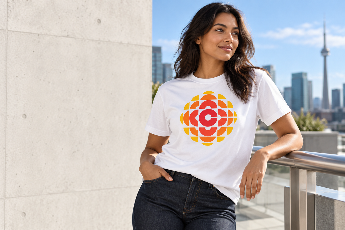 White CBC retro Gem T-shirt styled with dark jeans on a city terrace